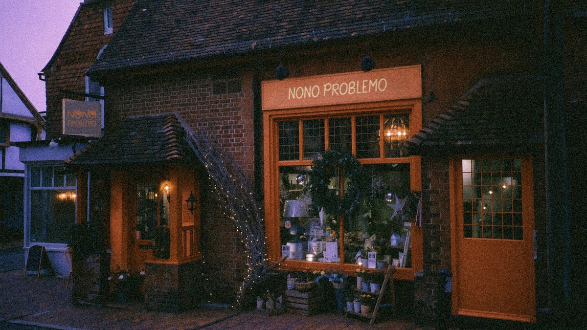Nono Problemo shopfront at dusk