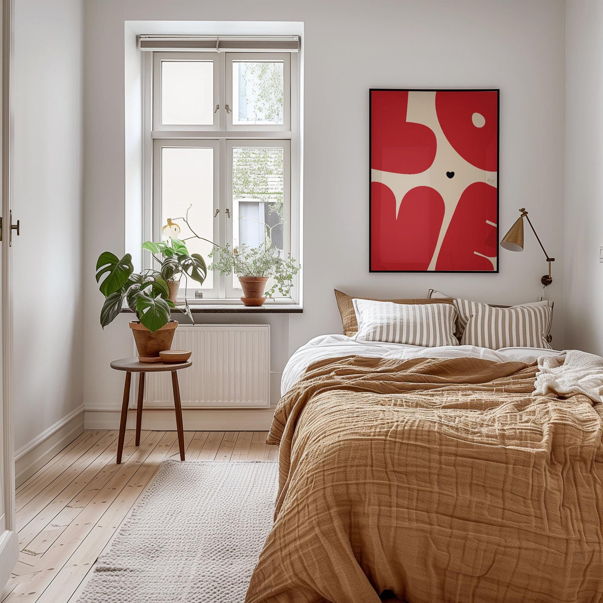 Bright bedroom with a linen-covered bed, plants by the window and a red heart print